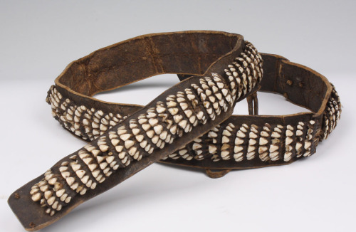 A 19th century Eskimo Shaman’s belt made out of teeth. This important belt features 100 individual sets of lower Carbou teeth! The belt likely had several crucial functions including summoning the power of the ancestors when worn by a shaman,  visual display of a hunter&rsquo;s skill, bravery and prestige. It could be given to a younger boy for spiritual protection when hunting. (Source)