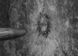 Bullet fired at a wall(Source)