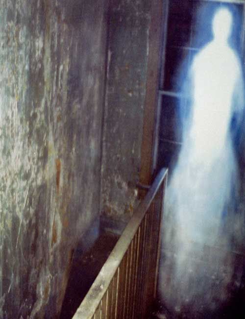 Abandoned House Ghost Photo, Missouri, USA. This was taken by Tom Halstead, in an old abandoned house. Tom reported that as he stood in a bedroom on the first floor, he looked around and saw a huge glowing entity moving up the staircase towards him. As the apparition reached the top of the stairs, it started to fade and disappear. This was when Tom managed to capture the ghost on film