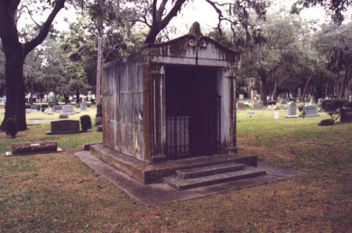 The Julia Legare Legend Back in the mid-1800s, Julia was declared dead and interred in the family’s mausoleum. 15 years later it was opened again and Julia’s remains were crumpled at the foot of the mausoleum’s door. She had been buried alive. The family horrified, entombed her once more. After that every time the door was closed it would be found open a day later.  Chains and unbreakable locks were used to keep the mausoleum sealed tight, but they would always break and the door would open. As little as 50 years ago a door was put on that could only be removed by industrial heavy machinery and that door was also opened.That’s when everyone gave up trying to close the door. To this day, the original door is nothing more than broken marble that sits in the grassy doorway to the tomb. It is thought her spirit can rest in peace.