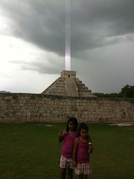 When Hector Siliezar visited the ancient Mayan city of Chichen Itza with his wife and kids in 2009, he snapped three iPhone photos of El Castillo, a pyramid that once served as a sacred temple to the Mayan god Kukulkan. A thunderstorm was brewing near the temple, and Siliezar was trying to capture lightning crackling dramatically over the ruins. In the 3rd photo, a powerful beam of light appears to shoot up from the pyramid. Siliezar, who recently shared his photographs with occult investigators said that he and his family didn’t see the light beam in person. It appeared only on camera.